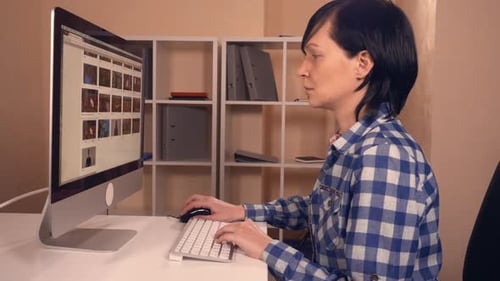 Female Sitting at the Working Place Use Pc