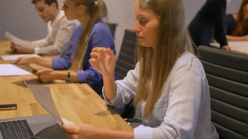 Business Ladies in Modern Night Office Interior Working.