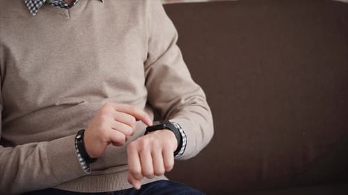Close Up Shot of the Men's Hands, Who Uses a Smart Watch To Check the Message
