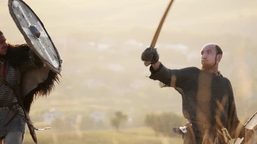 Medieval Men Fight with Swords and Shields on Hilltop