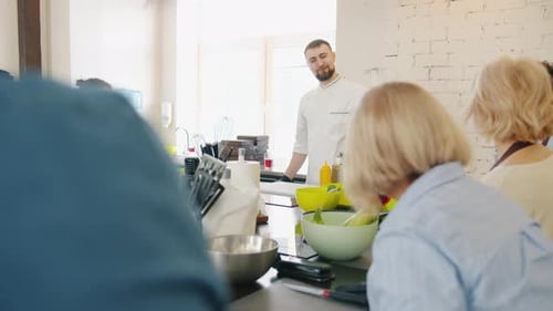 Chef Teaches Cooking Class to Adults