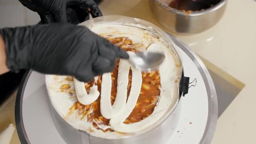 Decorating Cake with Brown Filling and White Frosting