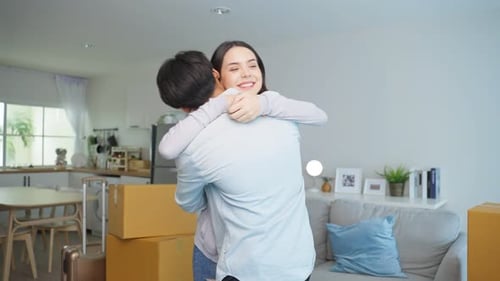 Attractive romantic couple, man surprise girlfriend by giving home key and moving to new house.