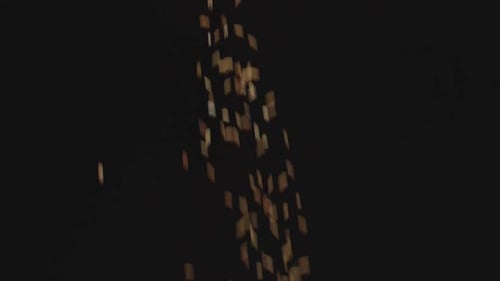 Brown Rectangles Falling on Dark Background