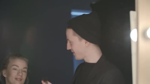 Makeup Artist Applying Makeup to a Model