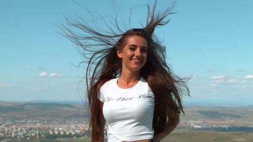 Brunette Woman with Long Hair Smiling Outdoors