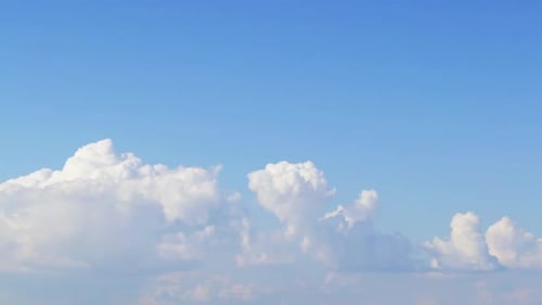 Clouds Swirl in the Blue Sky