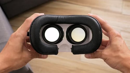 Hands Holding Virtual Reality Headset Close Up