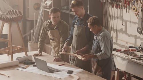 Carpenters Making Wooden Furniture in Workshop