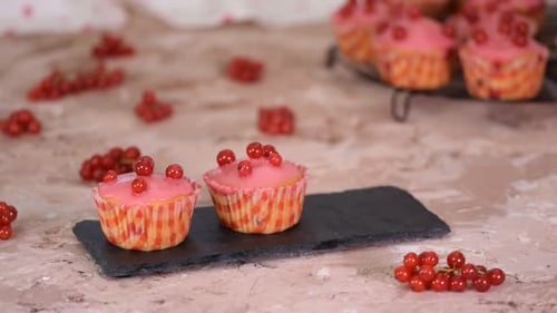 Delicious Cupcakes with Pink Icing and Berries
