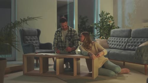 Husband and wife assembling table
