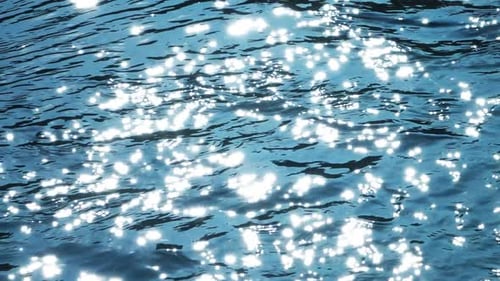 Sunlight Glistening and Reflecting on Blue Water
