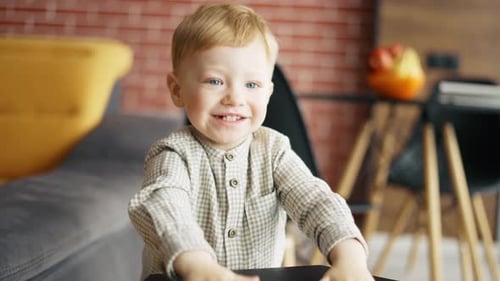 Excited Blond Happy Little Toddler Boy Indoors