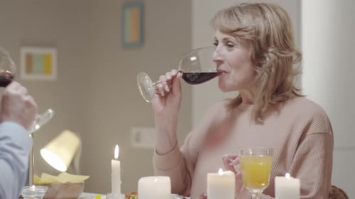 Romantic Older Couple Enjoying Wine at Dinner