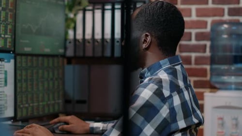 Financial Analyst Working with Real Time Stock Numbers
