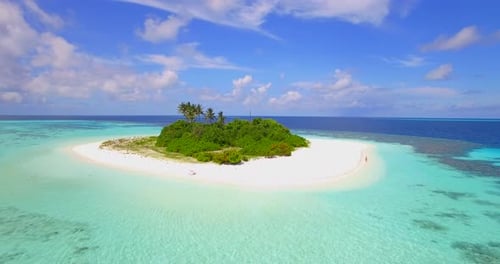 Aerial drone view of a scenic tropical island in the Maldives.