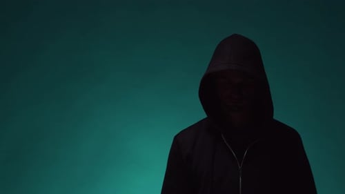 Mysterious Hooded Man with Hand Up