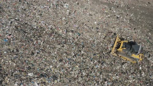 Aerial View of Bulldozer Working in Landfill