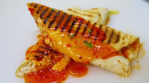 Delicious Wraps Topped with Sweet Chili Sauce