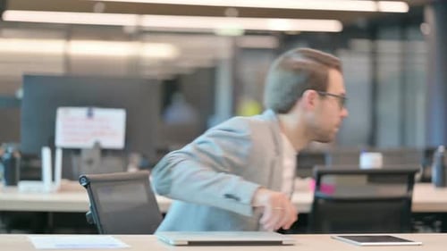 Man Leaving Laptop, Going Away in Office