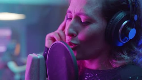 Female Singer Singing in Mic in Recording Studio