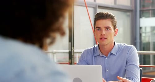 Young Adults Meeting in a Modern Workplace