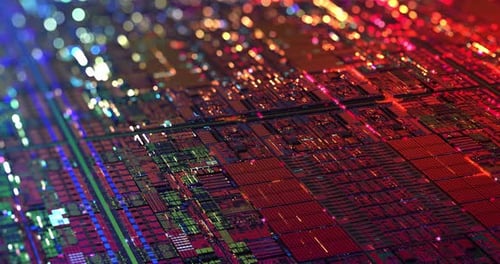 Iridescent Multi Colored Silicon Computer Wafer with Data moving within circuitry.
