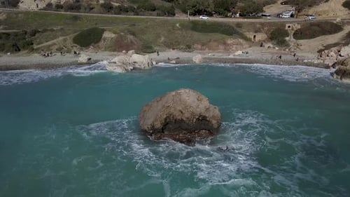Aerial View of Crashing Waves on Rocks