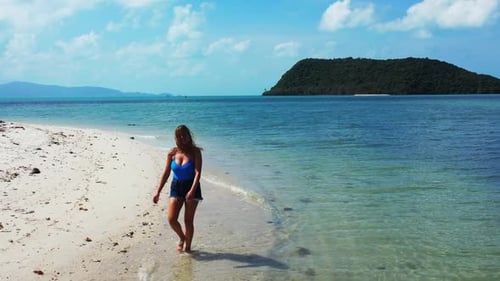 Beautiful ladies best friends on idyllic coastline beach vacation by blue lagoon with white sandy ba