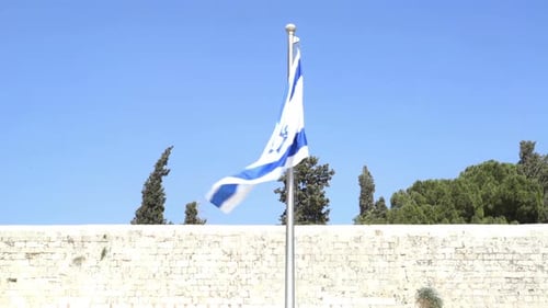 Flag of Israel Waving Against a Blue Sky