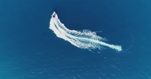 Aerial Top View of a White Pleasure Boat on a Summer Day