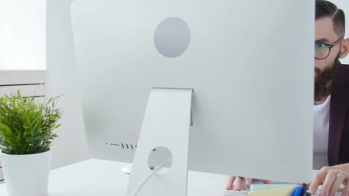 Concept of Freelancing and Work Office. Young Stylish Employee Looking at Computer Monitor During