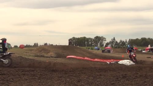 Motocross Race on Dirt Track with Jumps