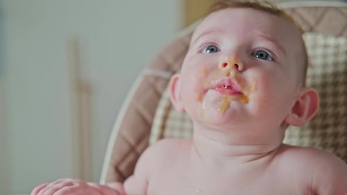 Baby Being Fed Pureed Food with a Spoon