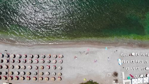 Aerial View of Scenic Beach with Umbrellas