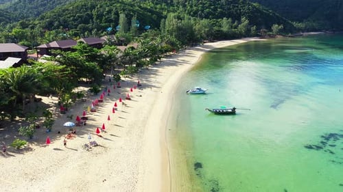 Daytime drone copy space shot of a paradise sunny white sand beach and aqua blue ocean background in