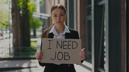 Woman with Placard I Need Job Standing Near Business Center