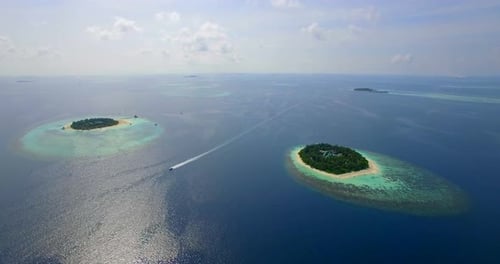 Aerial drone view of scenic tropical islands in the Maldives.