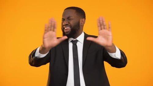 Man in Suit Rejects Something