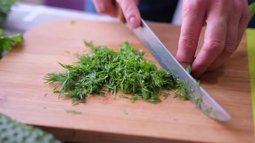 Dill Chopped Finely on Wooden Cutting Board