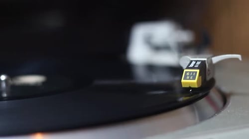 Vinyl Record Spinning on Turntable Close Up