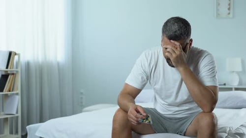 Upset Man Starts Taking Medicines to Treat Desease, Midlife Crisis Problem