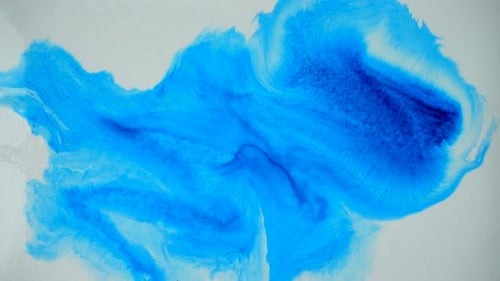 Blue Watercolor Paint Applied with Brush on White