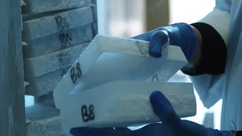 Scientist opening test tube box from freezer 4k