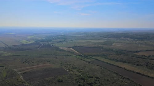 Aerial View Agricultural Field on Hillside in Mountains Near Village