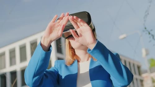 Woman Uses Virtual Reality Headset Outdoors