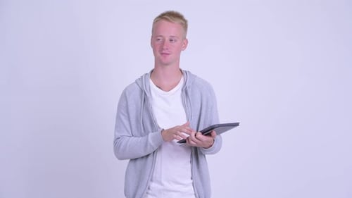 Young Adult Using Tablet and Thinking