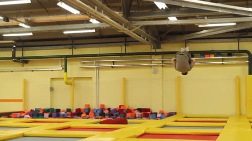 Young Man Having Much Fun on a Trampolines