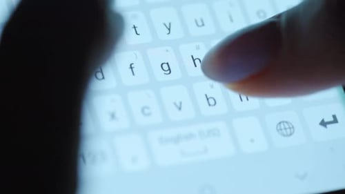 Hands Typing Text on Smartphone Close-up. Using Smartphone Close Up at Night.
