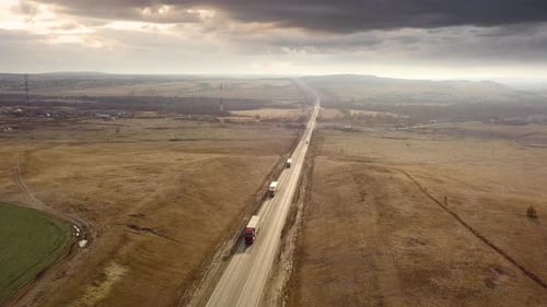 Rural Road Through Vast Flat Landscape Aerial View